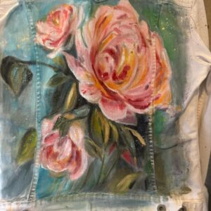 Hand-painted denim jacket featuring joyful pink coneflowers titled Beyond the Chaos